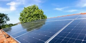 solar heater for house: Solar panels on a house roof, blue sky