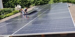 Family installing solar panels