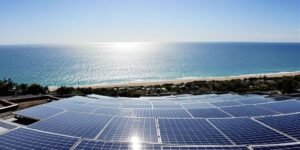 Solar panels on a roof near the ocean in La Rochelle.