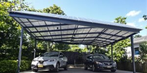 A large solar carport with two cars underneath.